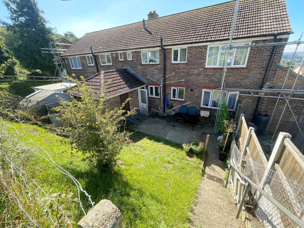 Lot: 146 - TWO-BEDROOM GROUND FLOOR FLAT FOR INVESTMENT - Patio area with shed/store